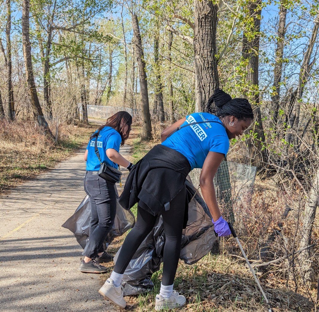Two of the 1800 plus volunteers cleaning up the Calgary riverbanks and pathways.